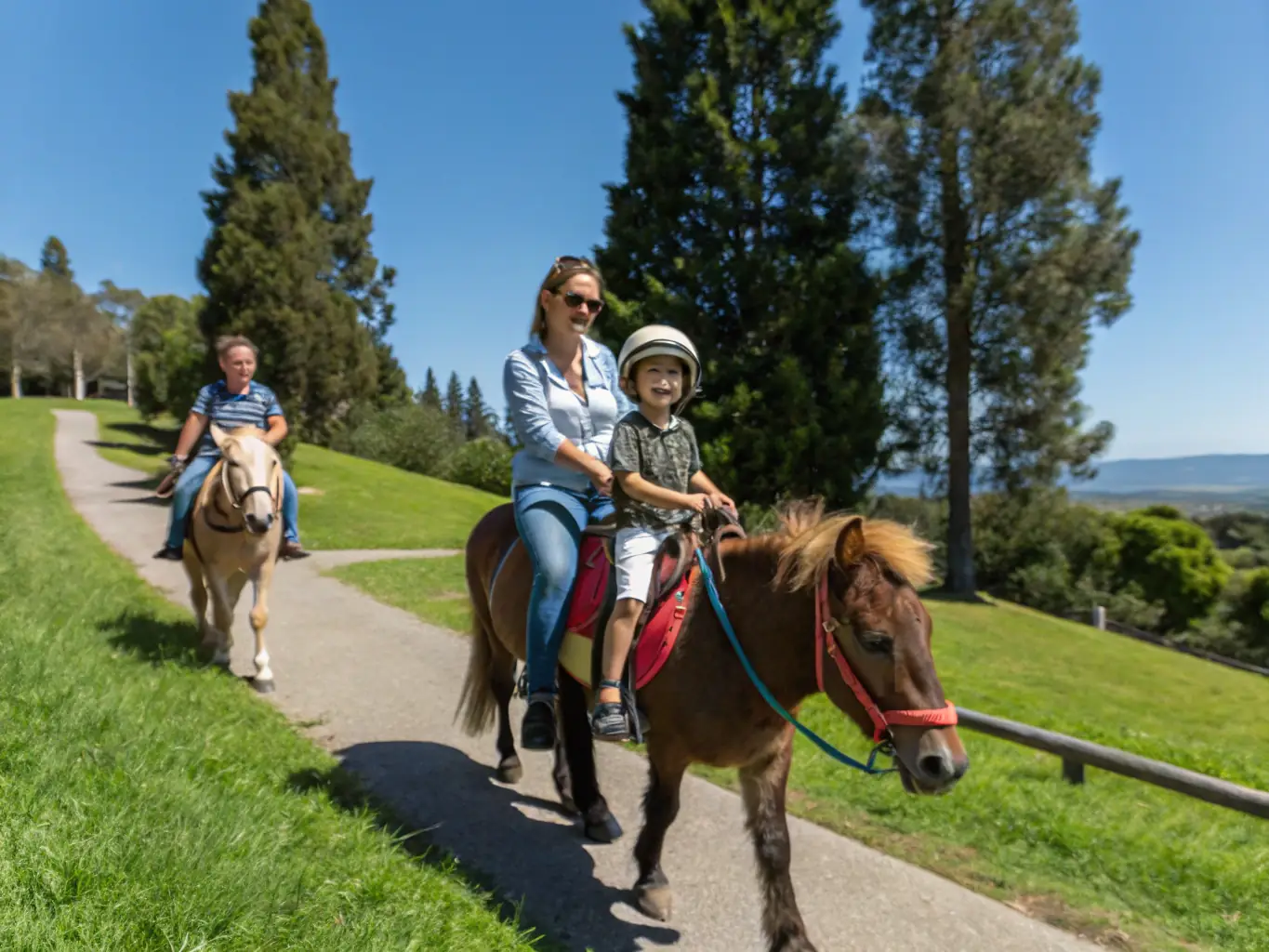 A group of riders and their families enjoying a social event at the farm, highlighting the strong sense of community and camaraderie.